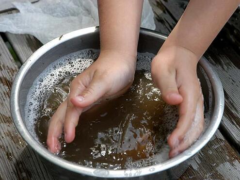 washing a rock in a bowl