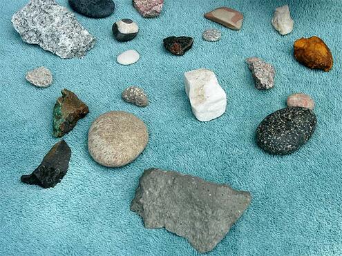 washed rocks spread out on towel to dry