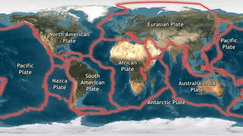 satellite view of Earth with major tectonic plate lines delineated in red and names of major plates