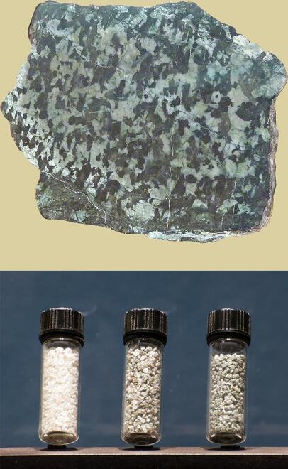 top: hunk of speckled gabbro rock. bottom: three vials of crushed minerals.