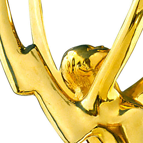 Close-up of the face and left wing of an Emmy Award.