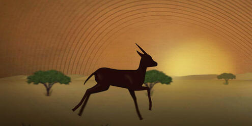 Gazelle galloping in an African savannah at sunset