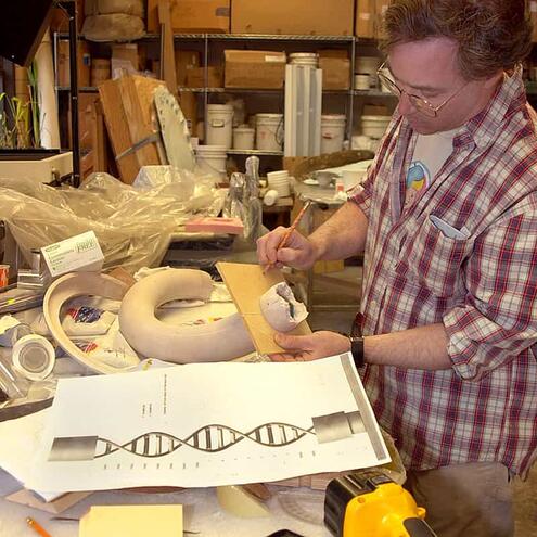 Rob examining models for the Genomic exhibit