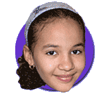 Headshot photo of smiling girl with hair slicked back. 