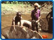 children in Africa fishing with net