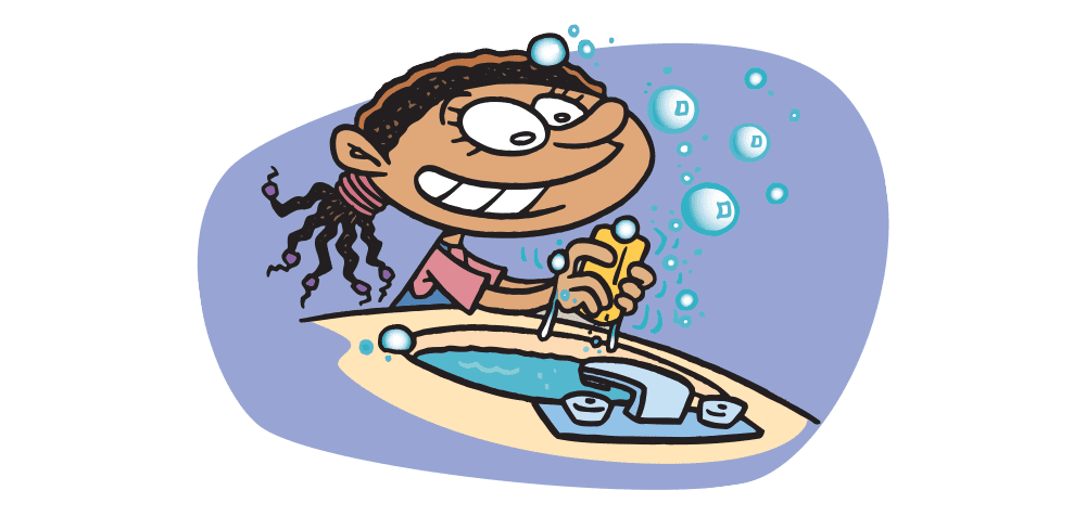 girl washing her hands at the sink