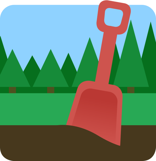 A plastic shovel in dark soil, with grass and forest trees in the background.