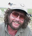 smiling head shot Mike Novacek with cap and sunglasses