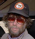 heat shot of Mike Novacek in cap and sunglasses