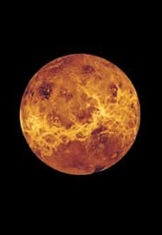 The round, bright planet Venus against dark background.