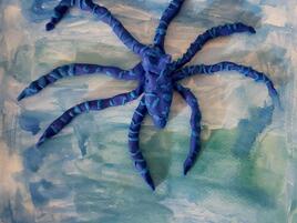 sculpture of a mimic octopus camouflaging in the water
