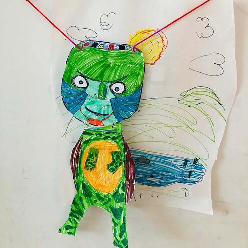 hand drawn green Kappa puppet on strings