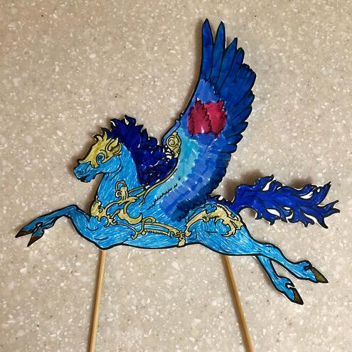 blue and gold illustrated pegasus puppet