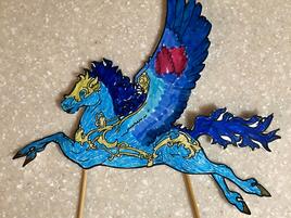 blue and gold illustrated pegasus puppet