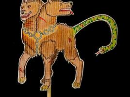 illustrated puppet of two-headed, serpent-tailed dog