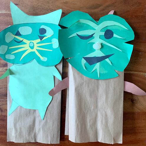 2 green faced hand made puppets