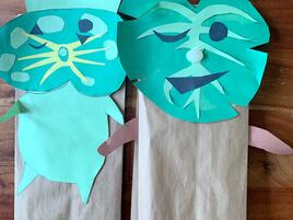 2 green faced hand made puppets