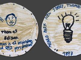 hand drawn coin with Thomas Edison on one side and a light bulb on the other