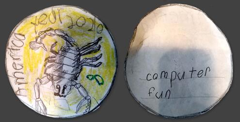 hand drawn coin with the year 2020 and scorpion drawing on it