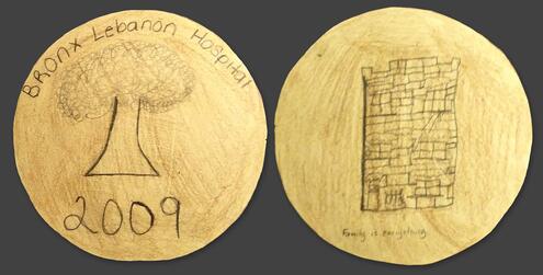hand drawn coin with words Bronx Lebanon Hospital, a tree, and year 2009 on one side. A fort on the other side.