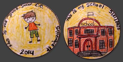 hand drawn coin with year 2014 and a boy on one side and a school on the other side