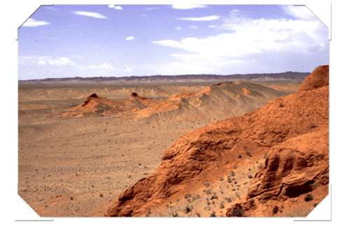 red rocks and hills of the Gobi Desert