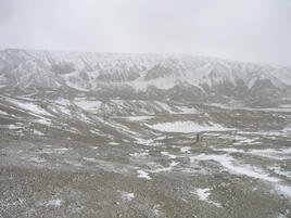 Frozen landscape with hills on the second term