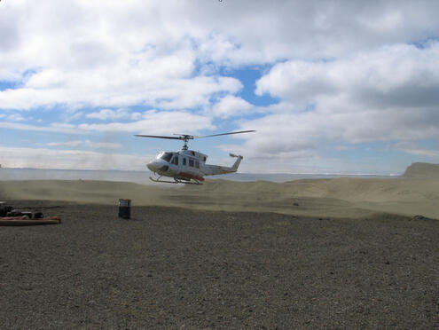 Helicopter landing in an isolated area without vegetation 