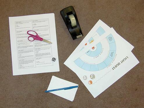 printout of game board, print out of trivia cards, scissors, tape, pen, one die and markers