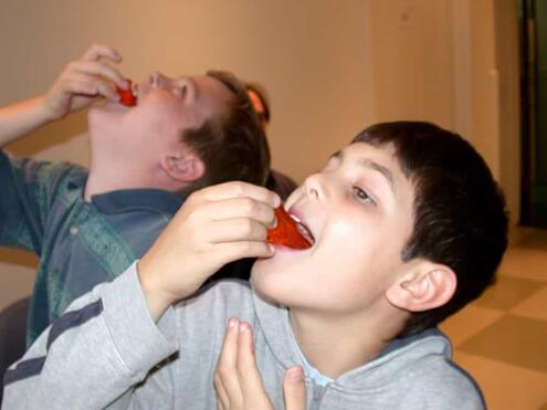 2 boys about to take a bite of Jell-O