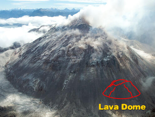 Rocky volcano with wide mouth emitting smoke