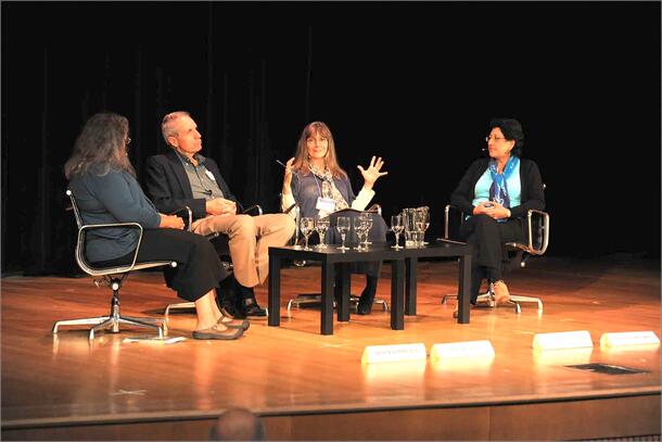 Panelists Dr. Avecita Chicchón, Dr. Malcolm L. Hunter, Dr. Robin Kimmerer and moderator Dr. Eleanor J. Sterling sit on a stage and speak.