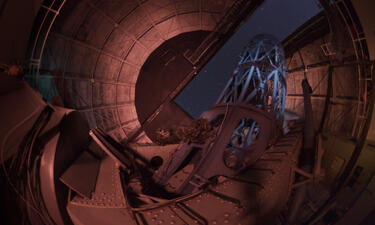 Image taken from inside an observatory looking up at the stars