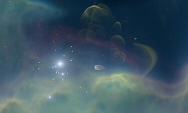 Vista de la nebulosa de Orión formada por nubes de gas verde y azul con decenas de pequeñas estrellas flotando en su interior. 