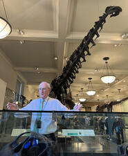A Museum volunteer speaks in the Hall of Saurischian Dinosaurs.