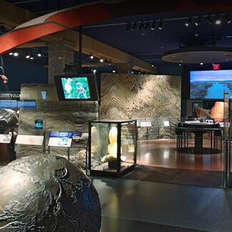 Interior of the Hall of Planet Earth at the Museum, with various models and displays.