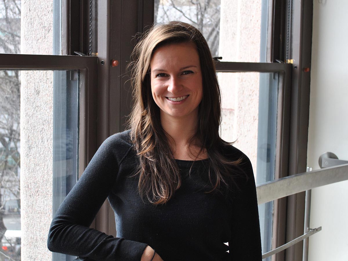 photo of Kristin Douglas smiling near a window. 
