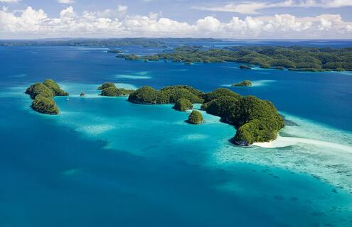 Ariel view of highly vegetated islands situated in open sea