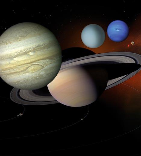 Rendering of four planets in space (from front to back): Jupiter, Saturn, Uranus, and Neptune.