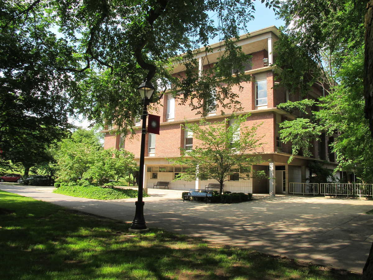 Rutgers campus, a building situated among some trees