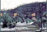 Conical piles of small rocks in a quarry.