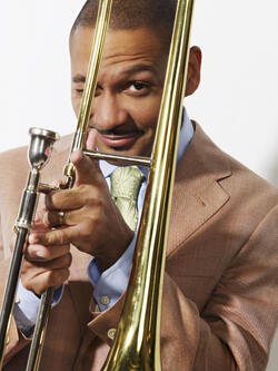 Delfeayo Marsalis winking through his trombone
