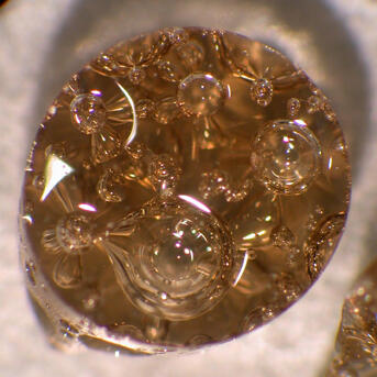 A glass bubble with "volatiles" from a volcano