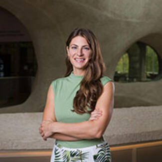 Headshot of Arianne Capirci in the Richard Gilder Center for Science, Education, and Innovation. 