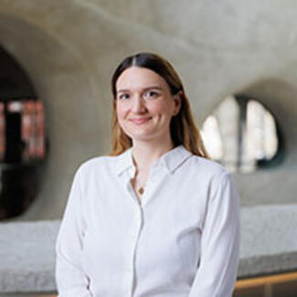 Headshot of Zoe Rawski in the Richard Gilder Center for Science, Education, and Innovation. 