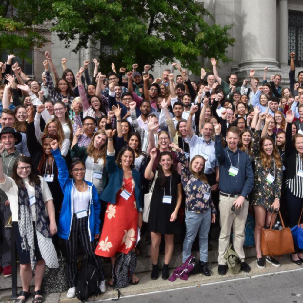 Group photo of over 150 people from the Student Conference on Conservation Science on the steps of the Central Park West Museum entrance.