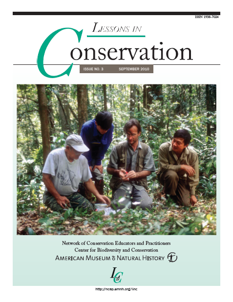 The September 2010 cover of the magazine “Lessons in Conservation” has a photo of four men kneeling in a lush green forest.