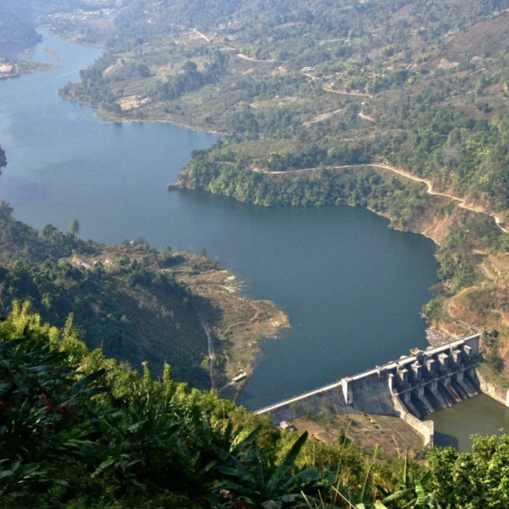 A large river is interrupted by a dam. 