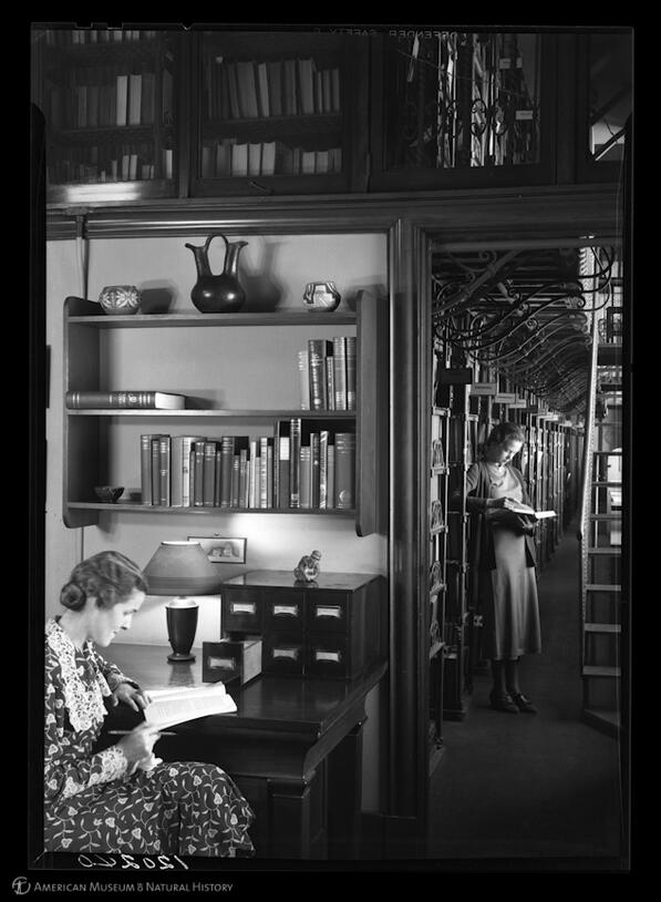 Photograph of Elizabeth MacKenzie and Esther Morton in the Museum Library stacks, February, 1937