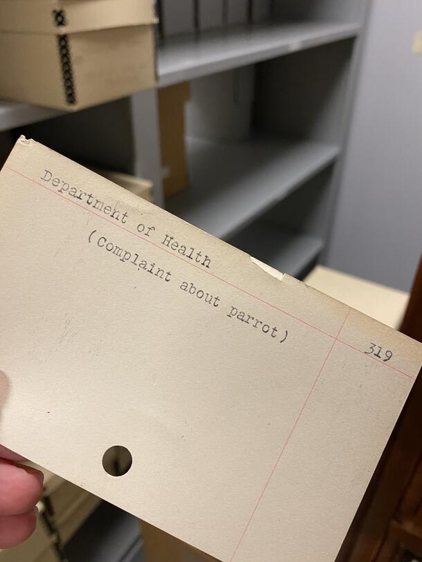 Close-up of AMNH Department of Health subject card with reference to parrot complaint, AMNH card catalog.